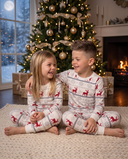 Siblings at Christmas time wearing their Cubwear Pyjamas. 