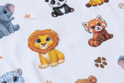 Close-up of the neckline and premium stitching on white animal print pyjamas