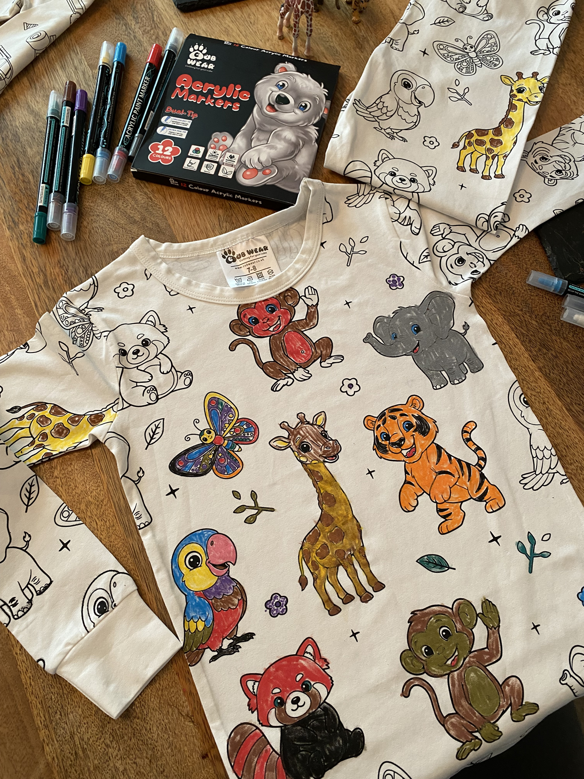 Finished Animal Colouring Pyjamas showing colourful hand-coloured animal designs