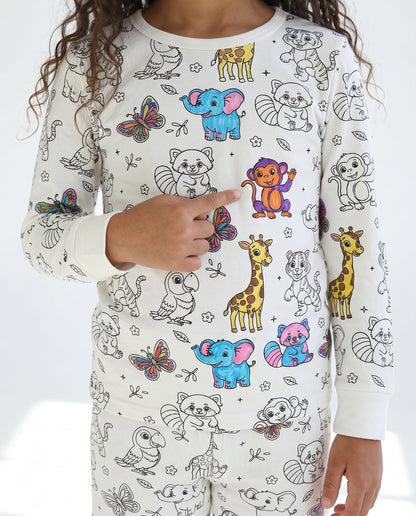 Girl wearing personalised Animal Colouring Pyjamas decorated with colourful animals
