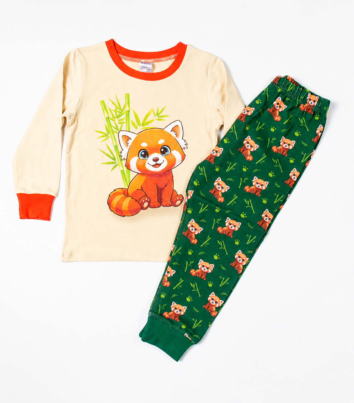 Kids Red Panda pyjama set with cream top and green printed trousers flat lay