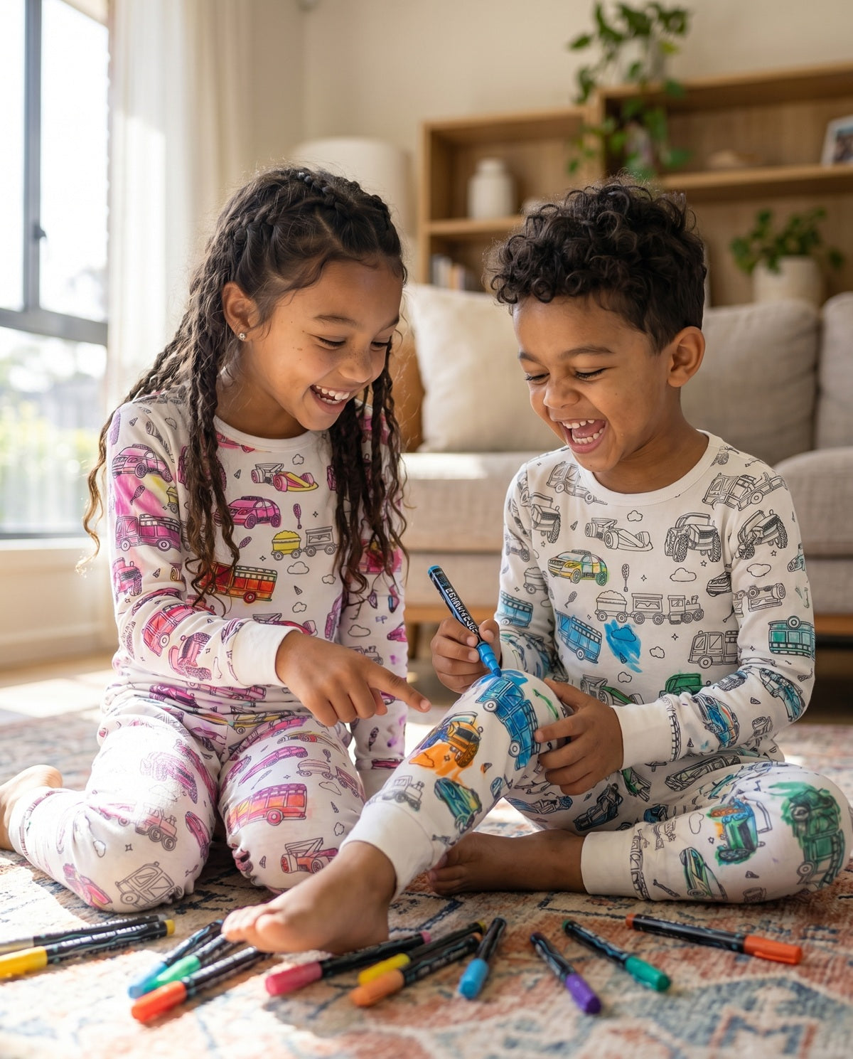 Children colouring their Vehicle Colouring Pyjamas with washable fabric pens